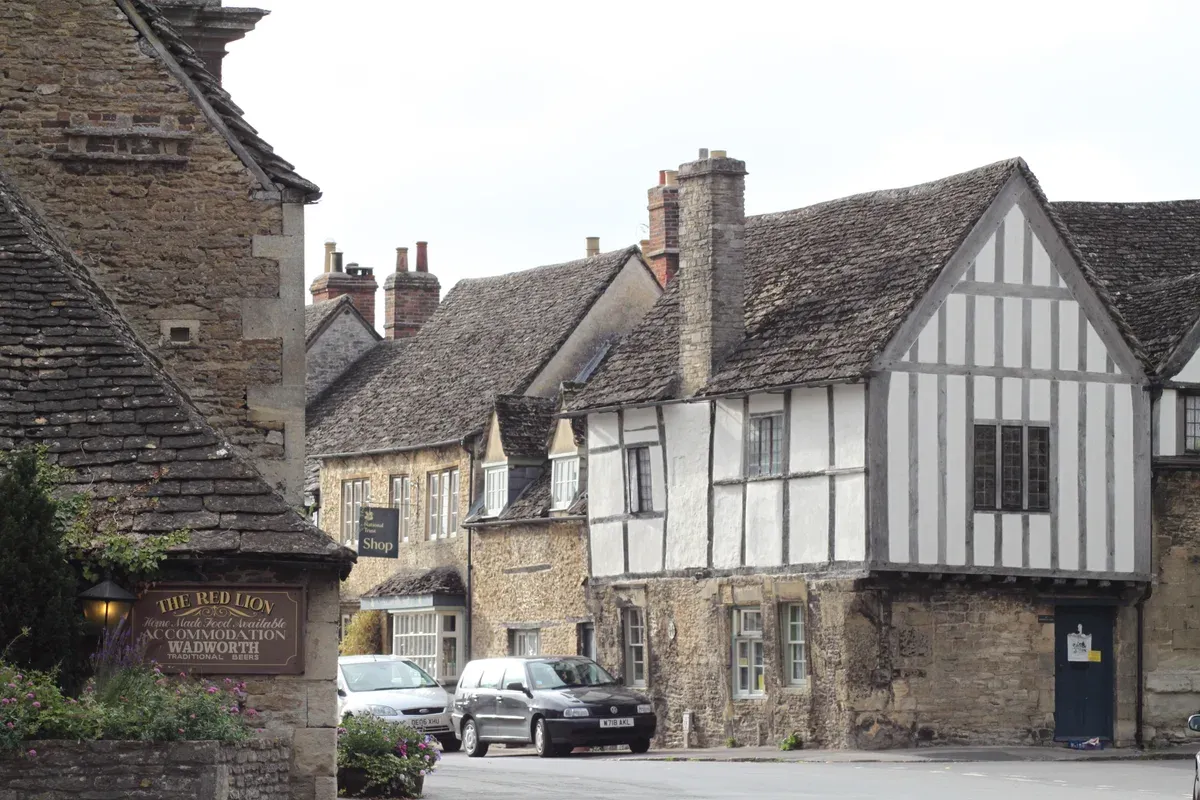 Half-timbered cottages on the High Street in Lacock, a stop on Stonehenge tours from London, Wiltshire